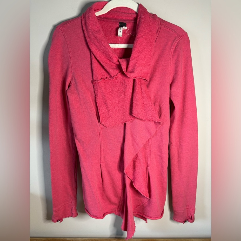 We The Free Pink Knit front zip ruffled sweatshirt.